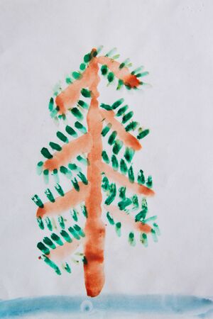 Children's drawing of alone Christmas tree standing in snow. New Year tree. Childish art. Artwork of New Year holidaysの写真素材