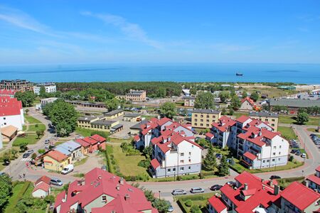 Cozy Polish town Wladyslawowo with view of Baltic Sea. Beautiful cityscape of Wladyslawowo town from above with streets houses cars and seaのeditorial素材