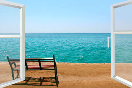 Window of room overlooking Empty bench near sea. Lonely bench on beach near Red sea. Exotic relaxation. Holiday concept. Empty bench near coastline at tropical resortの写真素材