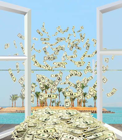 Heap of dollars flying away from window overlooking tropical island. Dollar bills by opened window...