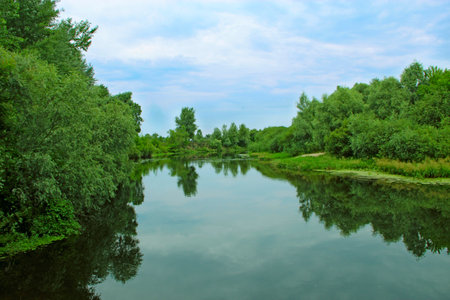 Landscape with river in summer. River landscape with green sides. Beautiful summer landscape. Travel concept. Vacation concept. summer holidaysの写真素材