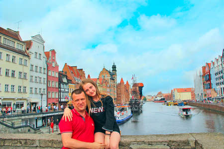 Family of two persons resting by city canal. Happy dad and daughter enjoy life. Photo of relatives...