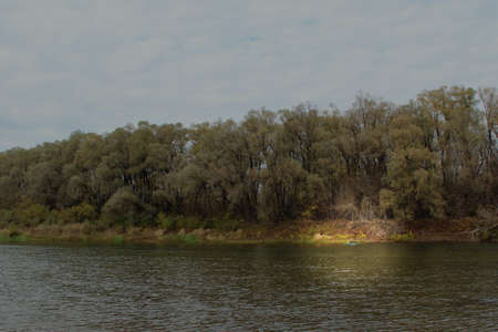 poacher fishing on boat. Fishing boat. fisherman floats on inflatable boat on river. Autumn fishing....