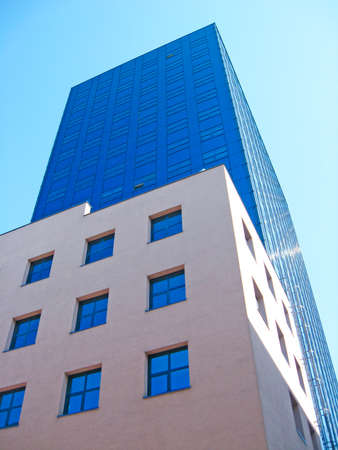 High glass skyscraper in Warsaw. Modern architecture of city buildings. Business center with modern buildings in Warsaw. Skyscraper in city. Business centerのeditorial素材