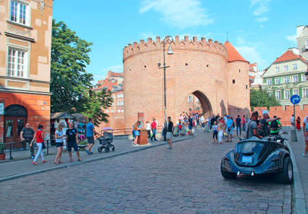 beautiful street in Polish capital Warsaw. old building in city. people resting in the capital of Poland Warsaw city. Modern architecture and street in Polish capital Warsaw. people relaxingのeditorial素材