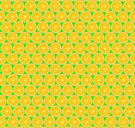 Texture of sliced orange slices on green background. Cut pieces of orange. healthy lifestyle. Health...
