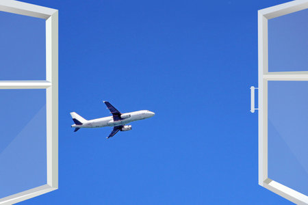 Opened window with view to flying plane. Flying plane in window. airport close to home. view from...
