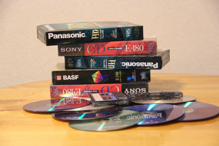CDs, cassettes, video cassettes. Attributes of the 1990s. memory entries. video memory recording. Hobby of the 90s. Passion for music in the 1990s. Compact disks video and audio tapesのeditorial素材