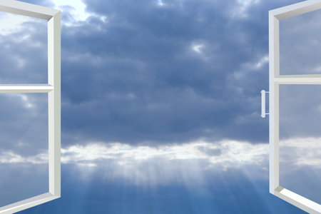 Window of room overlooking blue sky with dark clouds and sunny rays. Modern window with sky...