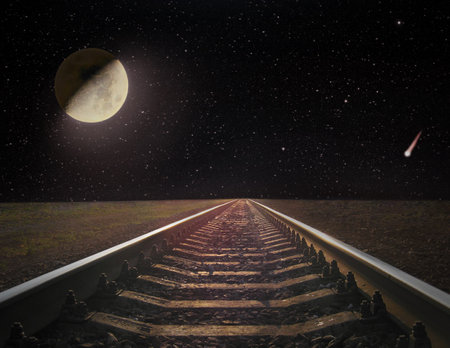 View of rails and the moon at night. Night railway road. Travel concept. Road into the night. Night...