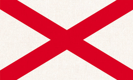 Flag of American state Alabama on fabric surface. Alabama state flag on textured background. Colored flag of Alabama on fabric surface. Symbol of American stateの写真素材