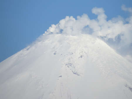 Beautiful winter volcanic landscape of Kamchatka Peninsula: view of eruption active Klyuchevskoy...