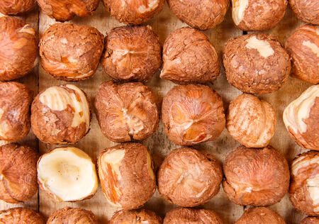 peeled nuts on wooden boards