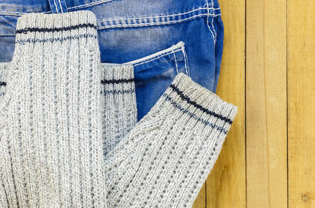 jeans and knitted sweater on the boardsの写真素材