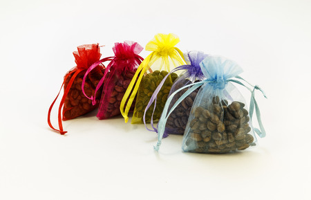 Coffee beans in gift bags on the white backgroundの写真素材