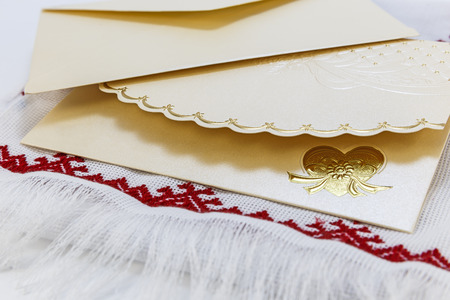 Invitation card on the decorative knit towel(soft focus)の写真素材