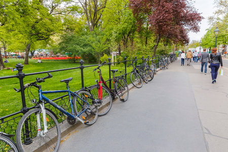 AUSTRIA,VIENNA - APRIL 17,2016:Bicycles parked in front of tourists the City Hall in Viennaのeditorial素材