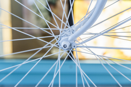 Bicycle painted white standing on the streetの写真素材