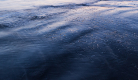 Texture of wet sand beachの写真素材