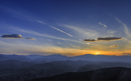 Beautiful sunset over the mountainsの写真素材