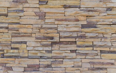 The texture of the wall of a variety of colored stones
