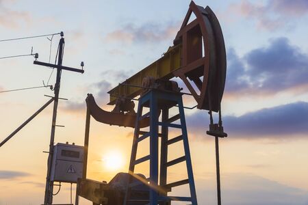 Oil rocking at sunset