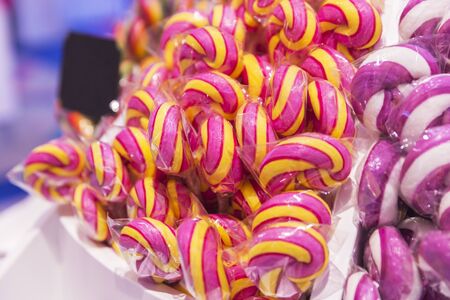 Swirling lollipops sold in a storeの写真素材