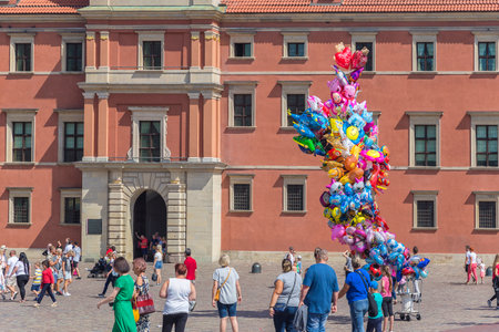 Warsaw, Poland - August 20, 2019: Balloon seller and walking tourists on Castle Square in Warsawのeditorial素材