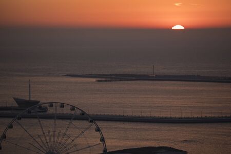 Bloody sunrise over the bayの写真素材