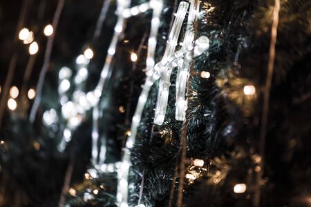 Christmas luminous snowflake on the Christmas treeの写真素材