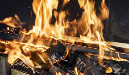 Burning coals fire from them in the grill