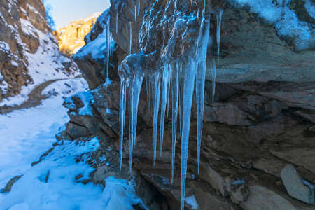 Icicles hanging on the rocks in the gorgeの写真素材