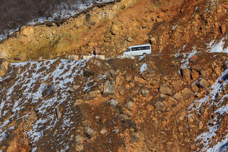 Truck on the edge of a cliff in the mountainsの写真素材