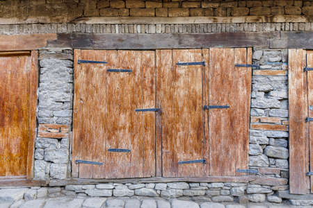 Vintage closed wooden doors in the village