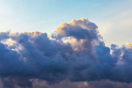 Beautiful clouds illuminated by the sun at sunsetの写真素材