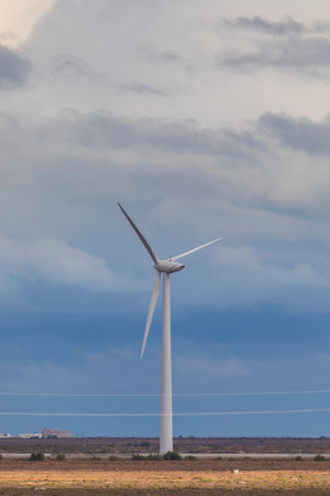Wind turbines against a gloomy skyの写真素材