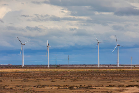Wind turbines against a gloomy skyの写真素材