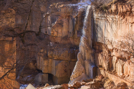 Frozen waterfall in the mountainsの写真素材