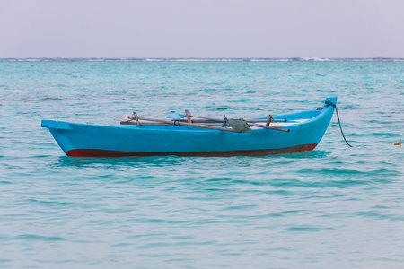 Fishing boat on the shoreの写真素材