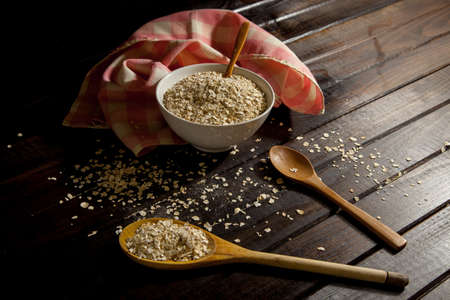 Bowl with oats and spoons