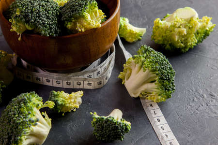 Fresh broccoli with a tape measureの写真素材