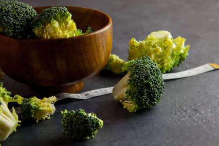 Wooden bowl with fresh broccoliの写真素材
