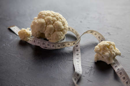 Healthy diet, cauliflower and measure tapeの写真素材
