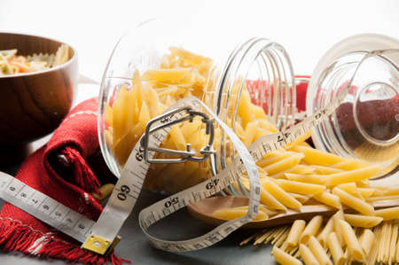 Raw pasta with metric tapeの写真素材