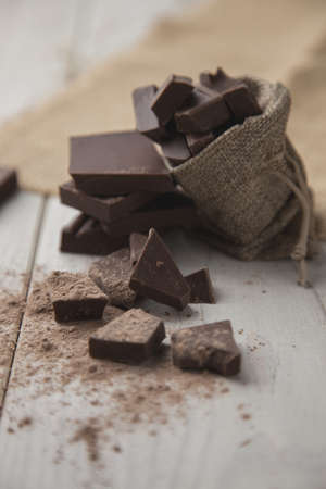 Sachet with pieces of dark chocolateの写真素材