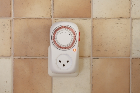 electricity timer on the wallの写真素材