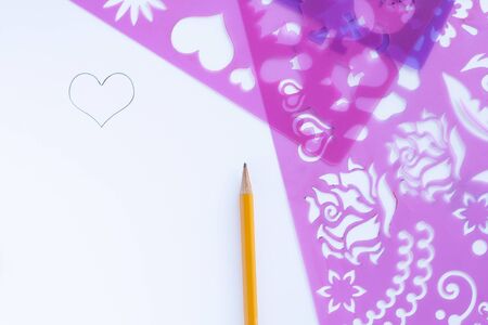 drawing on paper on a pattern or stencil.の写真素材