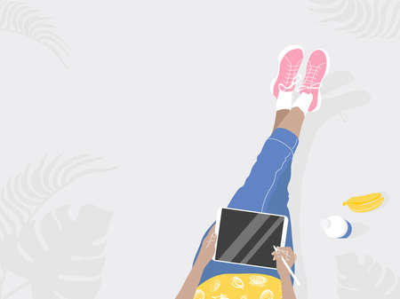 Vector poster Work from everywhere. Drawn in flat style, in bright colors.Girl with a tablet and pen, next to bananas and a bottle.Top view on a gray background. For design companies, freelance work.のイラスト素材