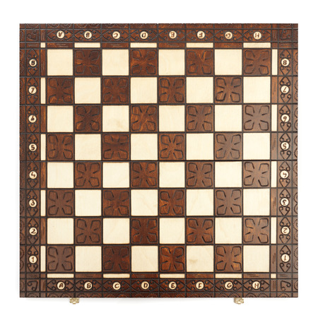 Wooden chess board isolated on white backgroundの写真素材