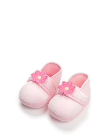 Baby girl pink shoes isolated on white backgroundの写真素材
